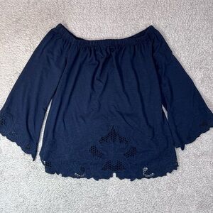 Adiva black top with cutouts on bottom of shirt and cuffs size medium